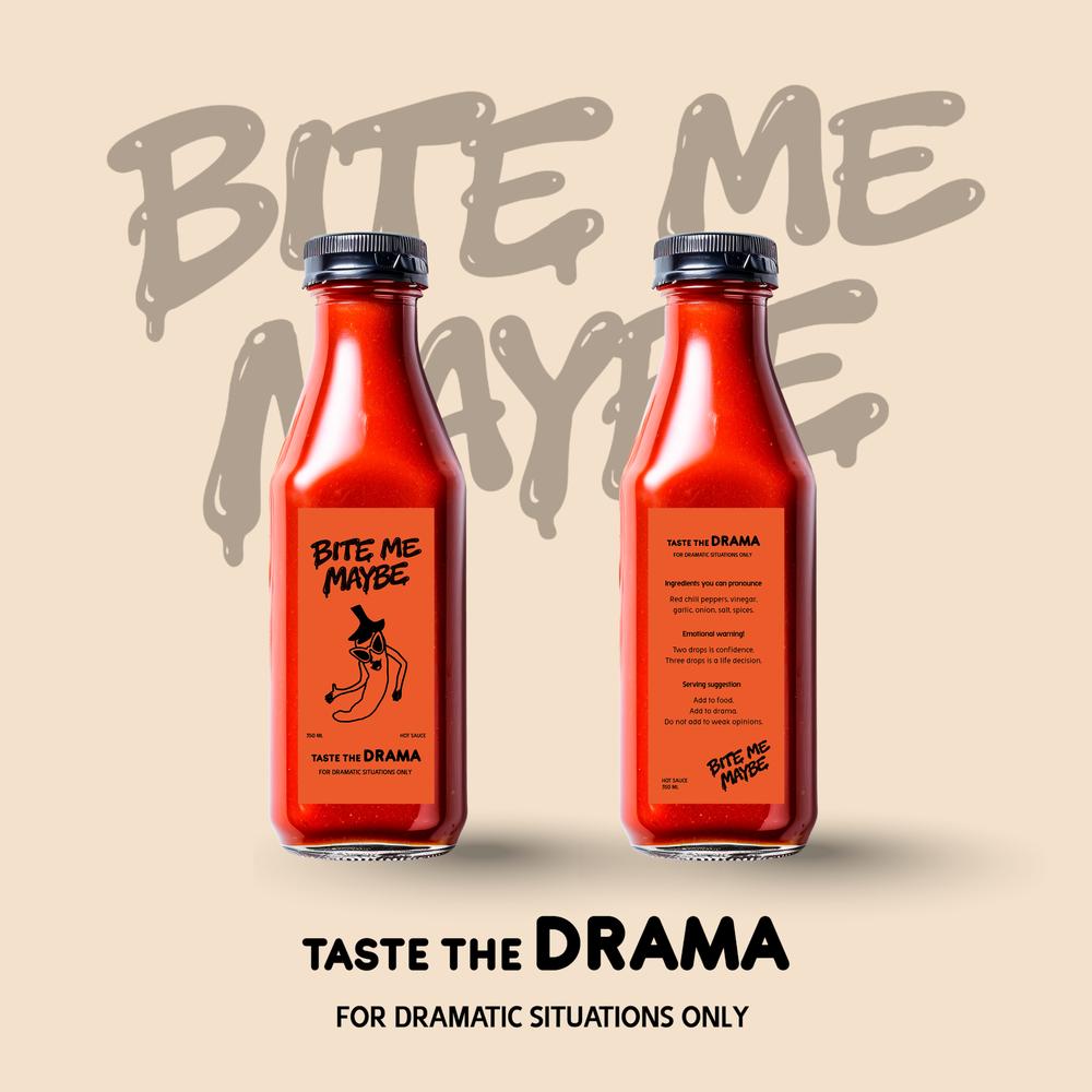 Two red bottles of Bite Me Maybe hot sauce featuring handwritten-style typography against a beige studio background.