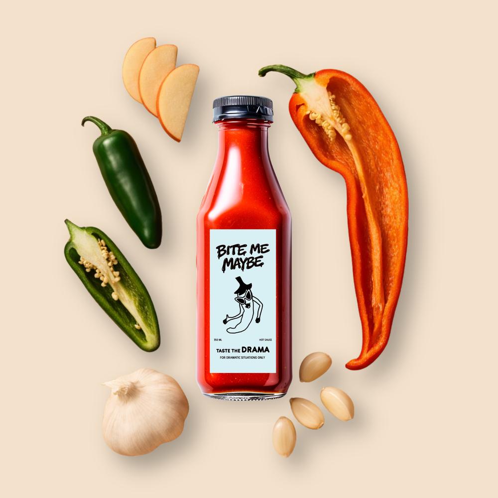 Flash photography flat lay of a hot sauce bottle surrounded by scattered garlic, jalapeños, and dried chilies on beige.