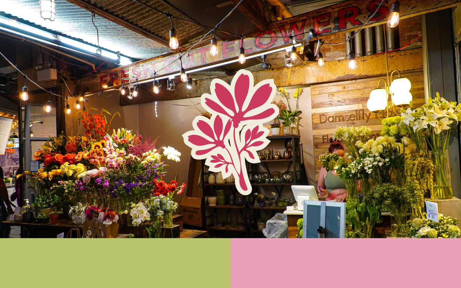 Rustic flower shop interior with wooden beams, warm lighting, and a large pink floral brand graphic overlay.